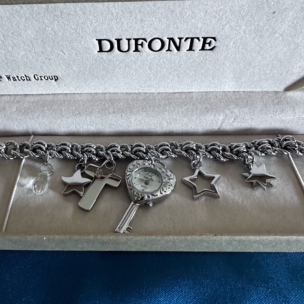 Rare Dufonte charm watch bracelet. By Lucian Piccard.